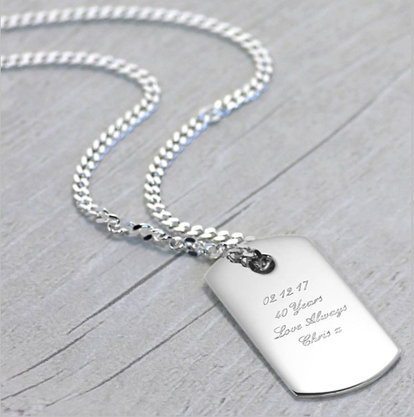 Silver Necklace With A Dogtag On It - featured image